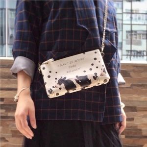 NWT Wristlet/Crossbody with double zipped pockets and cow print design